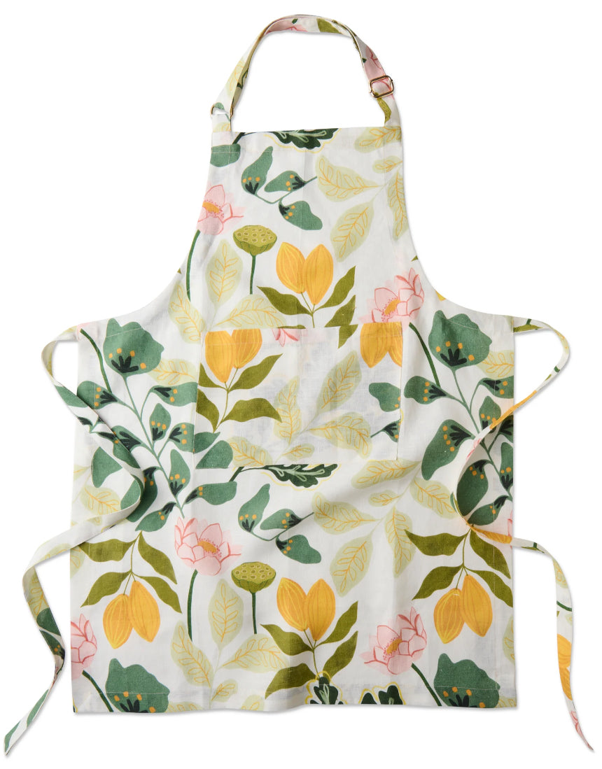 Kip & Co Wander apron featuring a colorful, patterned design with adjustable neck strap and large front pocket.