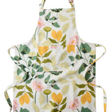 Kip & Co Wander apron featuring a colorful, patterned design with adjustable neck strap and large front pocket.