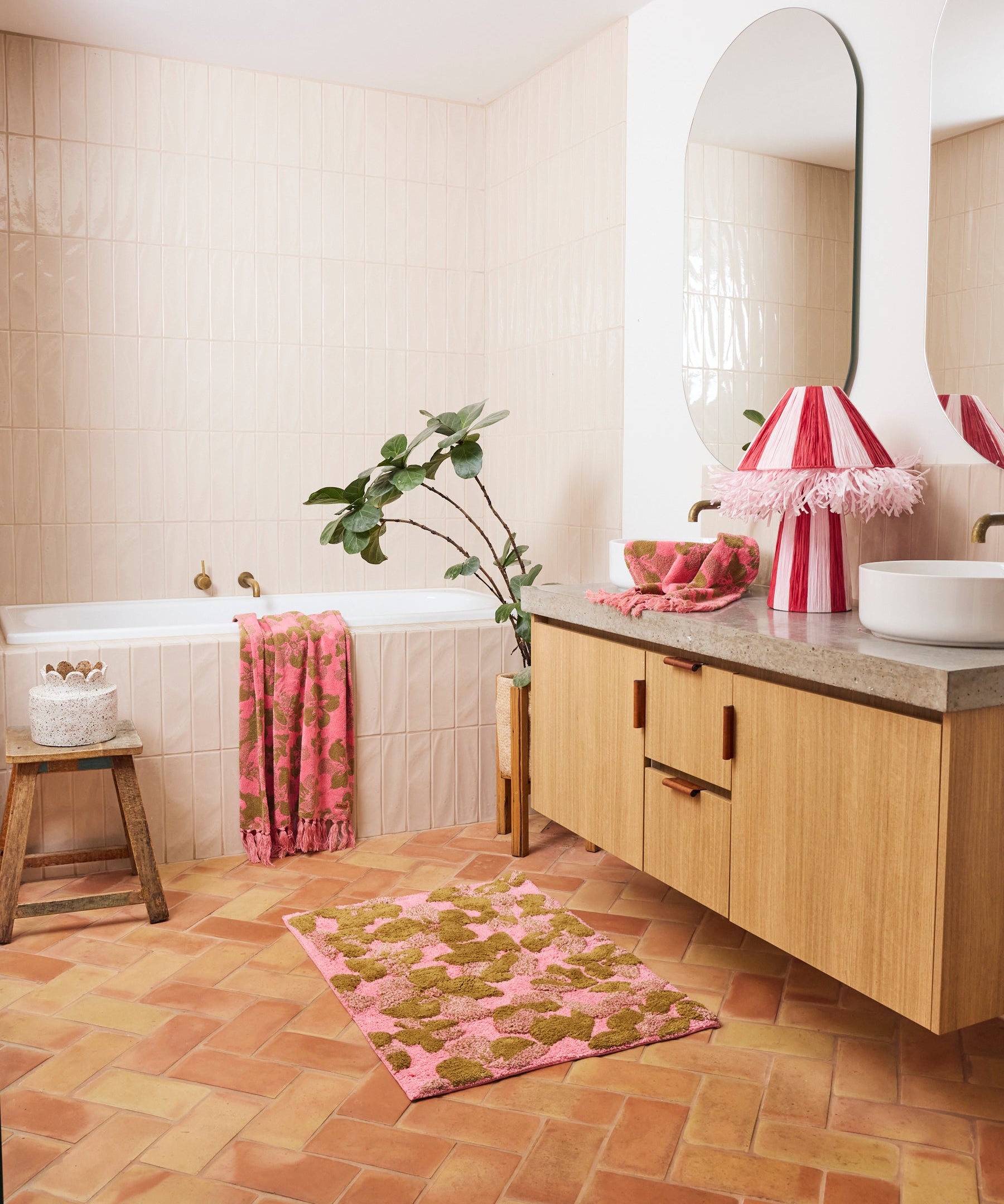 Kip & Co Bloom bath mat with colorful floral pattern, soft textured surface, and non-slip backing for bathroom safety.