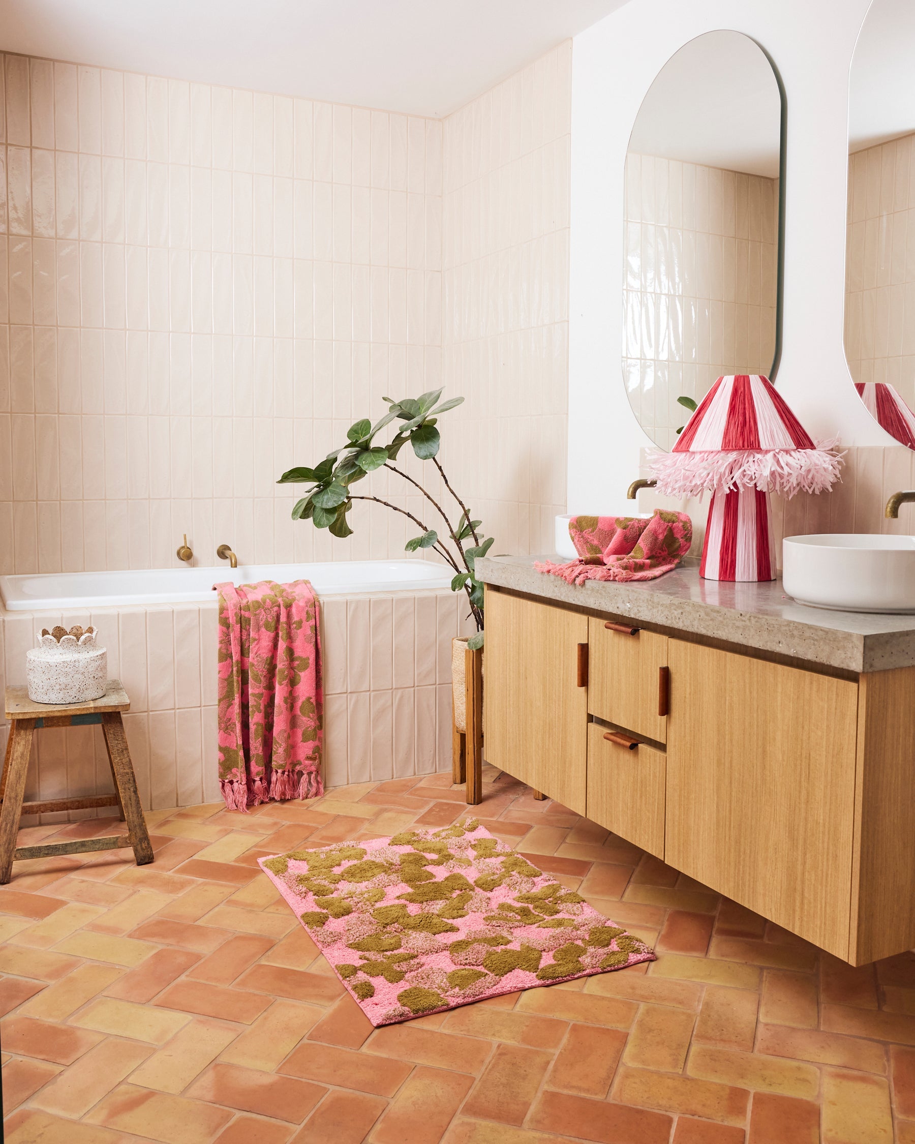 Kip & Co Bloom bath mat with colorful floral pattern, soft textured surface, and non-slip backing for bathroom safety.