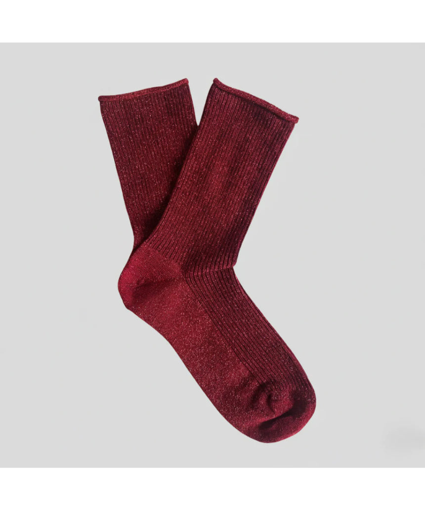 Cherry red Klue glitter lurex socks with a shiny, sparkly finish and ribbed cuffs, perfect for adding a pop of color to your outfit.