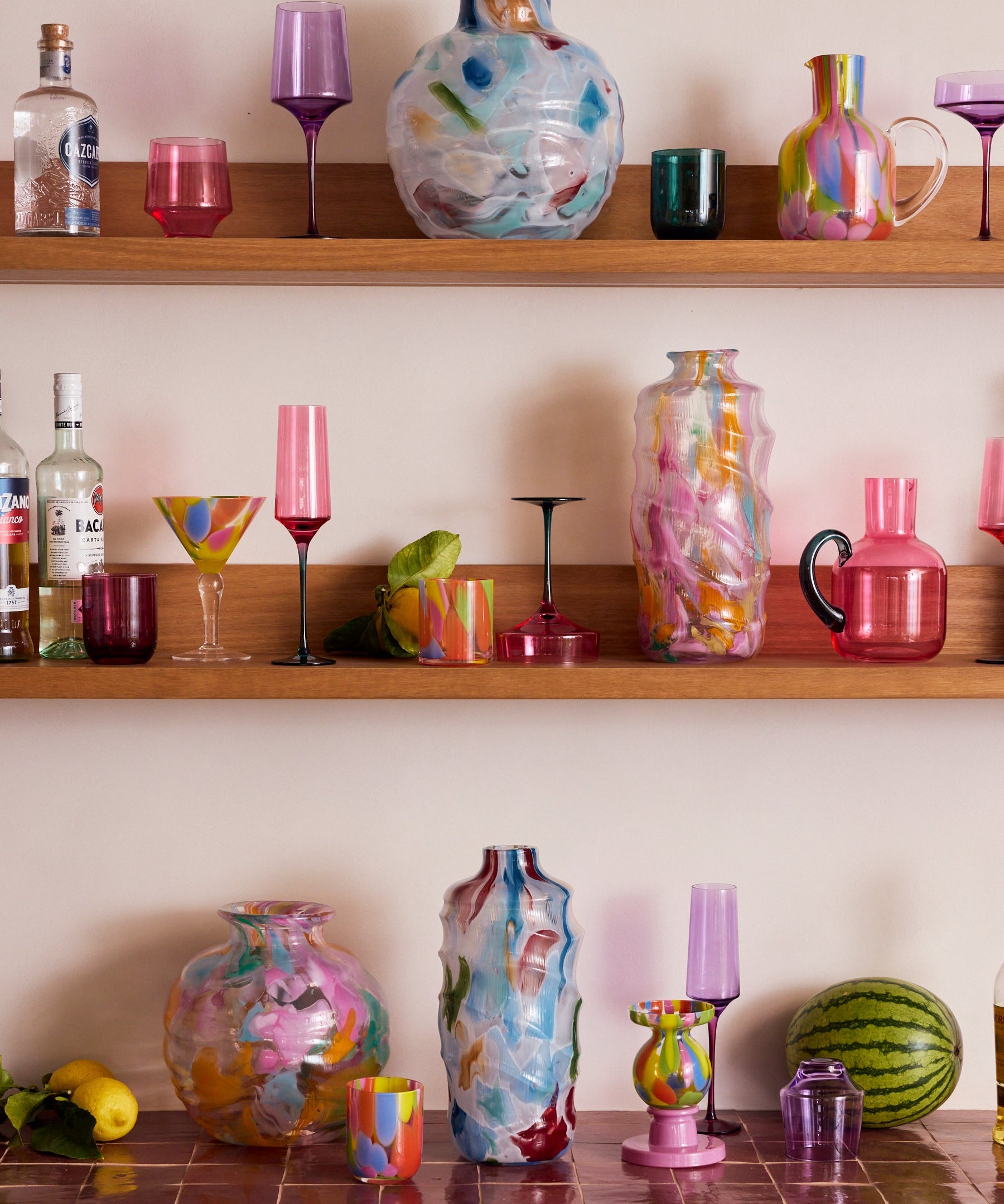 Kip & Co Isle Of Pink glass carafe with matching glass, featuring vibrant pink and colorful design for serving beverages.