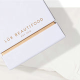 Lük Beautifood Lip Nourish Trio with three nude-colored lip balms in sleek containers, perfect for natural, moisturized lips.