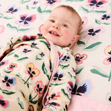 Kip & Co Pretty Pansy organic cotton baby blanket with colorful floral pattern and soft texture.