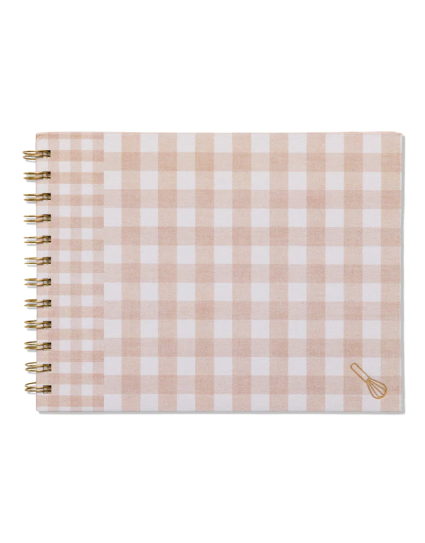 Designworks Ink meal planner and market list with classic gingham cover, featuring organized sections for meal planning and shopping lists.