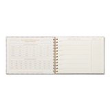 Designworks Ink meal planner and market list with gingham pattern, featuring organized sections for meal planning and grocery lists.