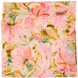 Kip & Co warm floral breeze tablecloth with vibrant floral pattern, made of soft fabric, shown spread on a table.