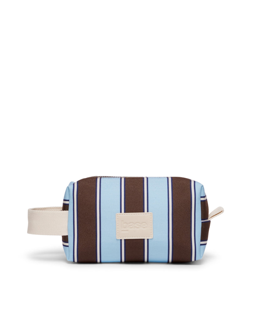 Base Ditty Base in chocolate stripe fabric, showcasing its textured pattern and stylish design.