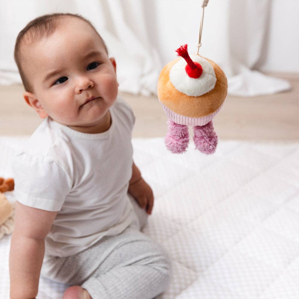 Living Textiles stroller toys set featuring colorful ice cream and cupcake plush toys for baby entertainment.