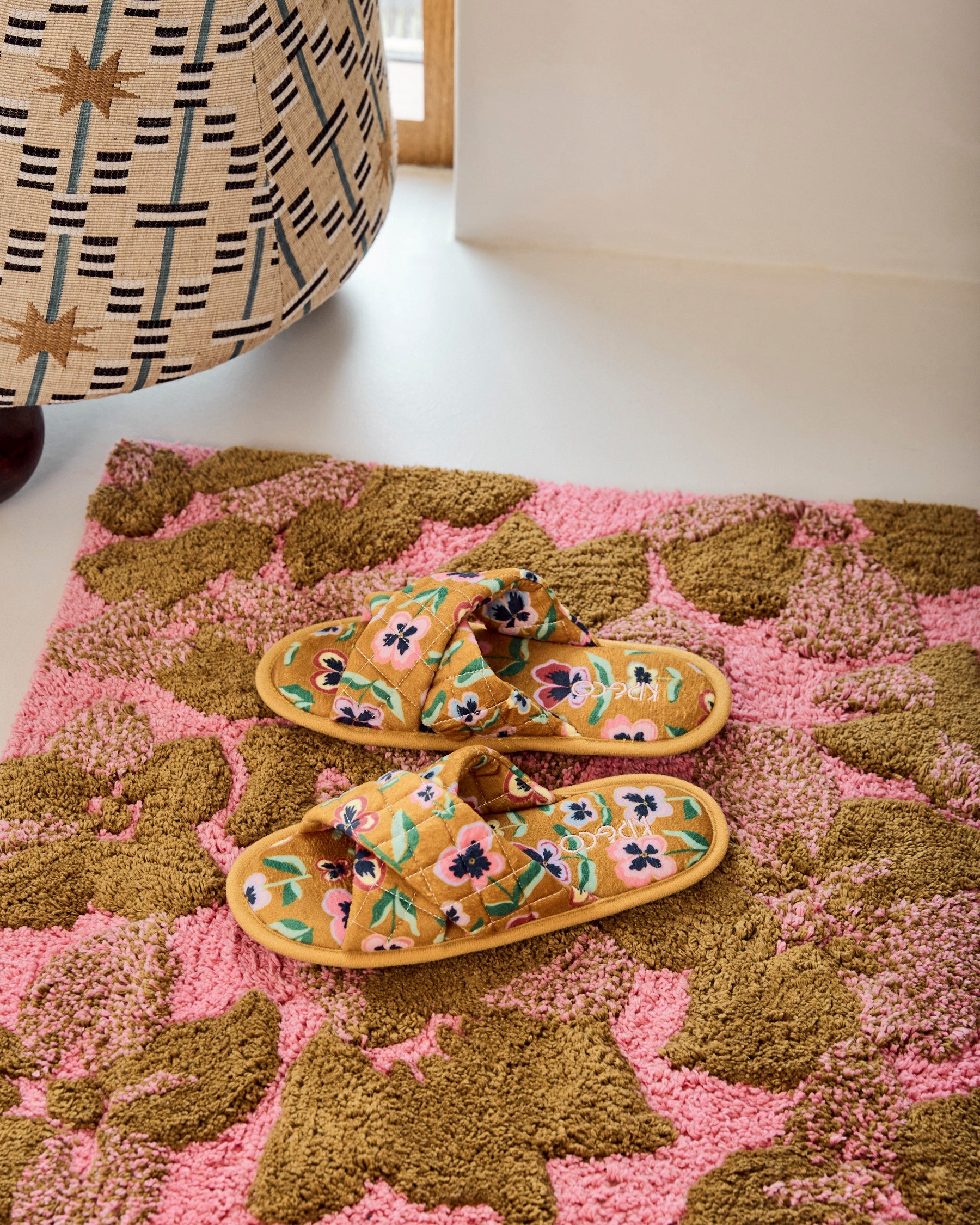 Kip & Co Bloom bath mat with colorful floral pattern, soft textured surface, and non-slip backing for bathroom decor and safety