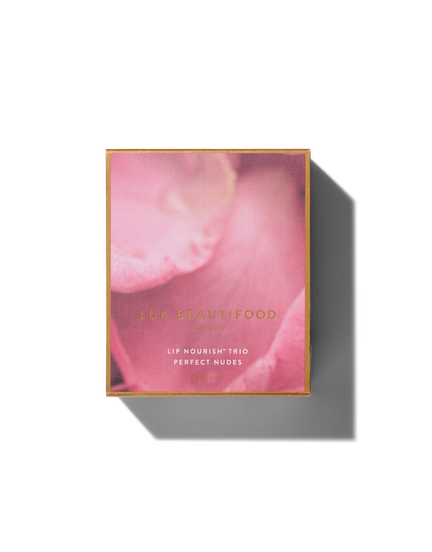 Lük Beautifood Lip Nourish Trio featuring three natural nude lip balms in sleek packaging, perfect for moisturizing lips.