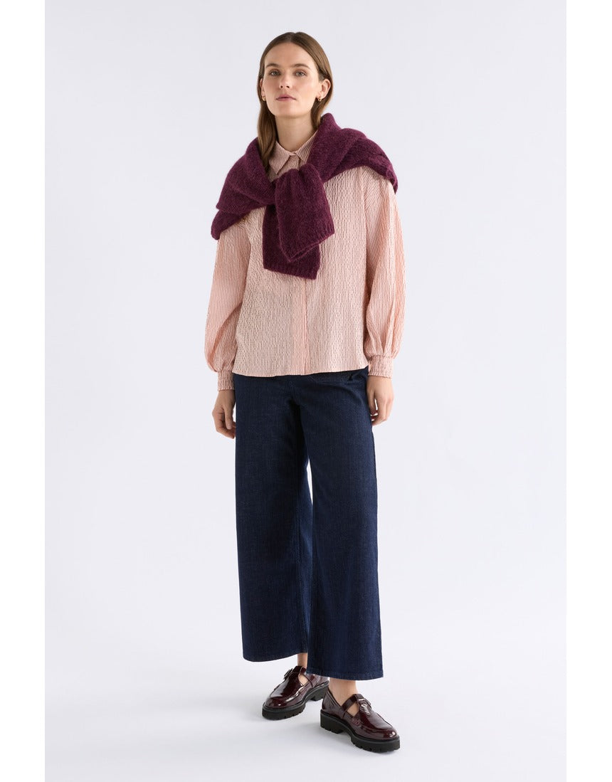 Pink Elk Erden Shirt from ELK The Label, a stylish women's top with a relaxed fit and soft fabric, displayed on a hanger.