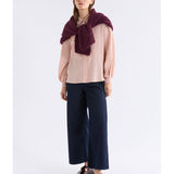 Pink Elk Erden Shirt from ELK The Label, a stylish women's top with a relaxed fit and soft fabric, displayed on a hanger.