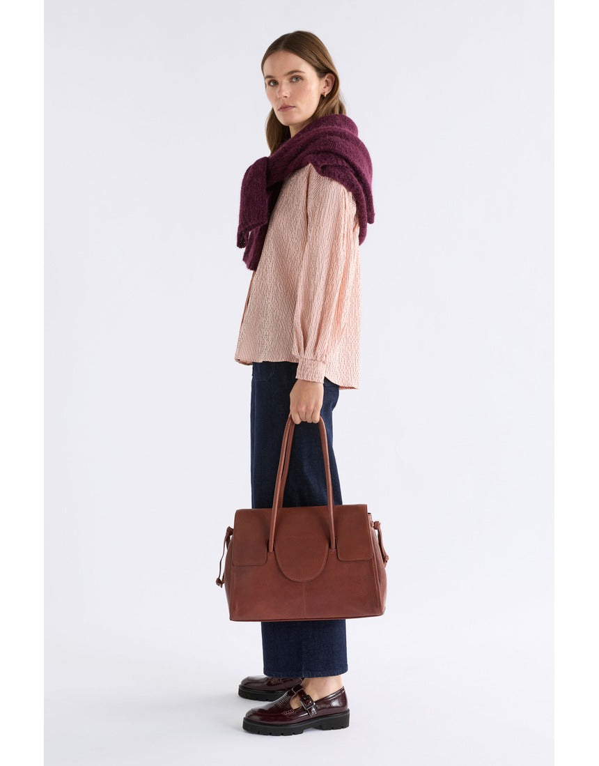 Pink Elk Erden Shirt from ELK The Label, stylish women's top with a relaxed fit and soft fabric, shown on a model.