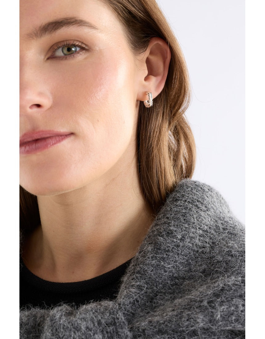 Silver Elk Hiva Mini Hoop Earring from ELK The Label, featuring a sleek, minimalist hoop design on a plain background.