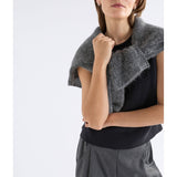 Black Elk Naya Knit Vest from ELK The Label, featuring a cozy knitwear design with a high neckline and textured pattern.