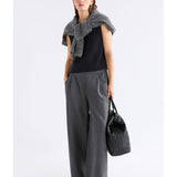 Black Elk Naya Knit Vest from ELK The Label, showing the sleeveless knitwear with a textured pattern on a neutral background.