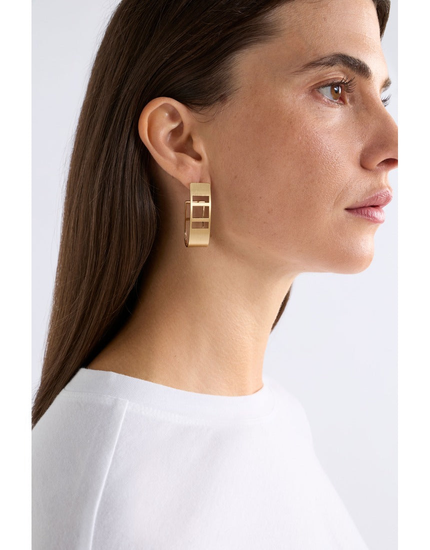 Gold Elk Skeni earrings by ELK The Label featuring delicate hoop design with subtle textured finish.