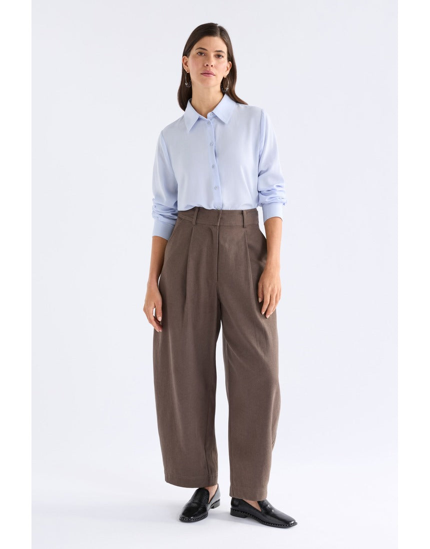 Pale blue Elk Tettu shirt by ELK The Label, featuring a relaxed fit and soft fabric, displayed on a hanger.