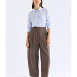 Pale blue Elk Tettu shirt by ELK The Label, featuring a relaxed fit and soft fabric, displayed on a hanger.