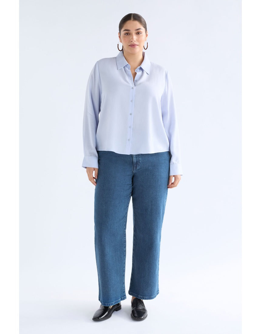 ELK The Label Tettu Shirt in pale blue, a stylish women's top with a relaxed fit and soft fabric, shown on a model.