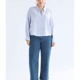 ELK The Label Tettu Shirt in pale blue, a stylish women's top with a relaxed fit and soft fabric, shown on a model.