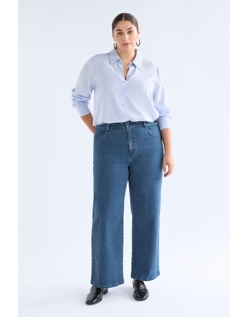 ELK The Label Tettu Pale Blue Shirt, a stylish long-sleeve top with a relaxed fit and soft fabric, displayed on a hanger.