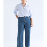 ELK The Label Tettu Pale Blue Shirt, a stylish long-sleeve top with a relaxed fit and soft fabric, displayed on a hanger.