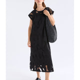 Black Elk Varr Burnout Dress by ELK The Label, showcasing its stylish dress design with a burnout fabric texture.