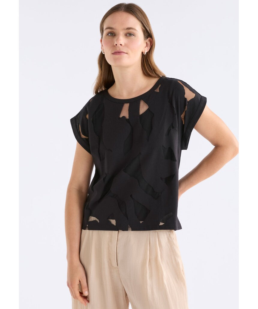 Black Varr Burnout Top by ELK The Label featuring a relaxed fit and burnout fabric, shown on a model.