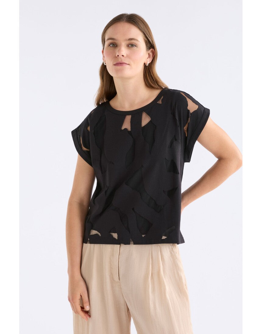 Black Varr Burnout Top by ELK The Label featuring a relaxed fit and burnout fabric, shown on a model.