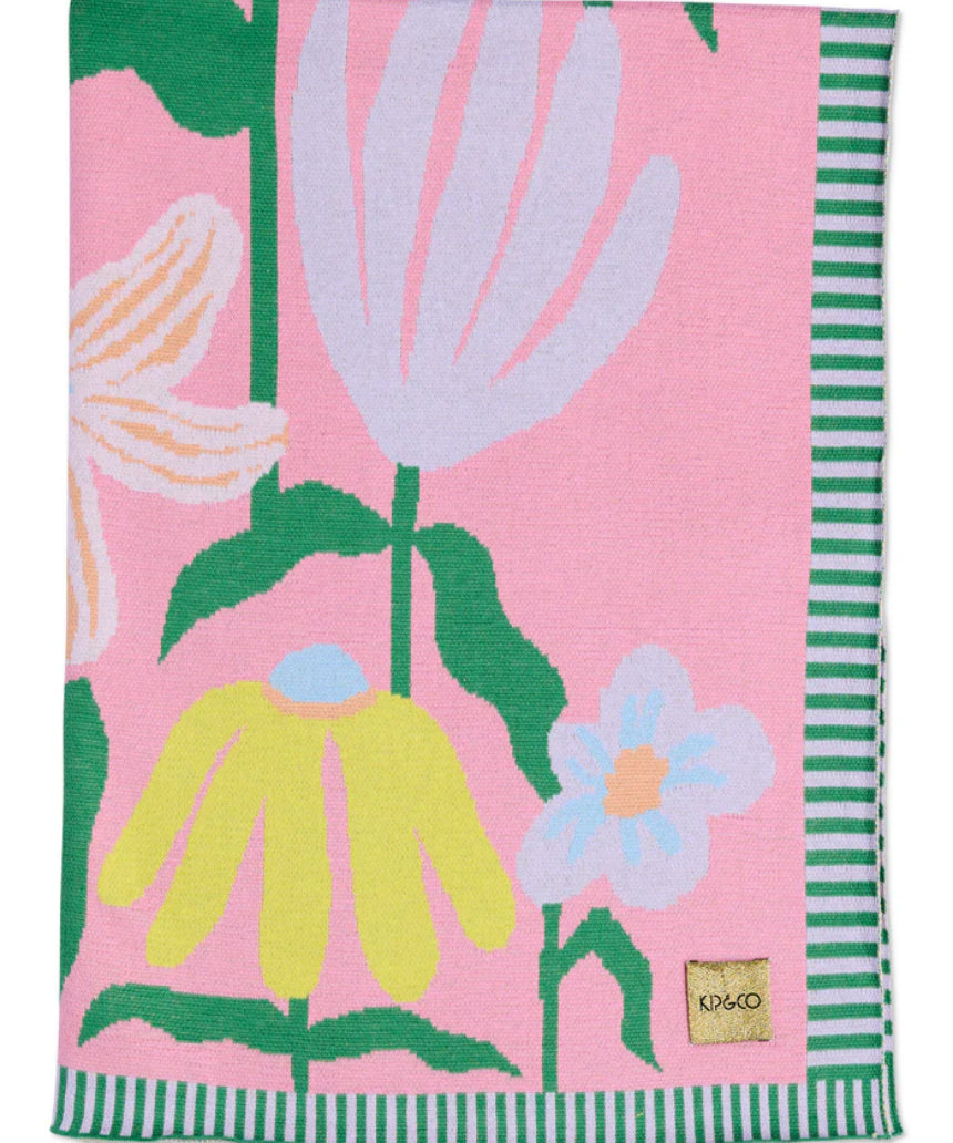 Kip & Co Popping Flowers Green cotton knitted blanket with colorful floral pattern, cozy and soft for bedding or lounging.
