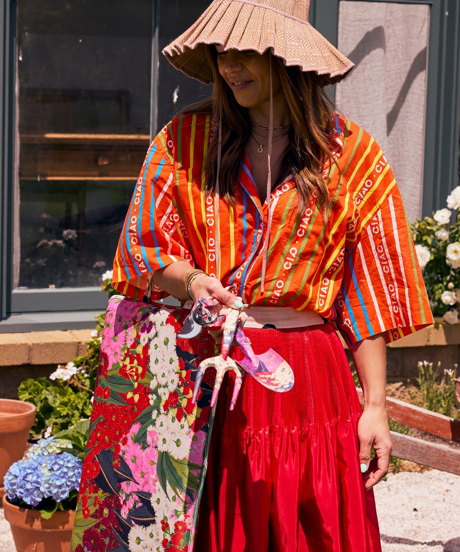Kip & Co Australian Bush Blossom garden tools and gloves set with colorful trowel, pruning shears, and floral gloves on a garden table.