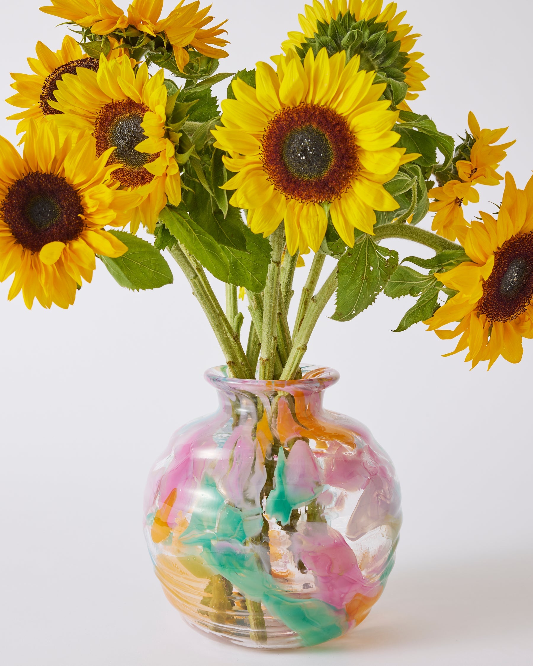 Kip & Co Swirl Sorbet round vase with vibrant, colorful swirl pattern, standing on a flat surface, decorative home decor piece