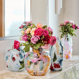 Kip & Co Swirl Sorbet round vase with colorful, abstract swirl design, made of ceramic, ideal for decorative floral arrangements.