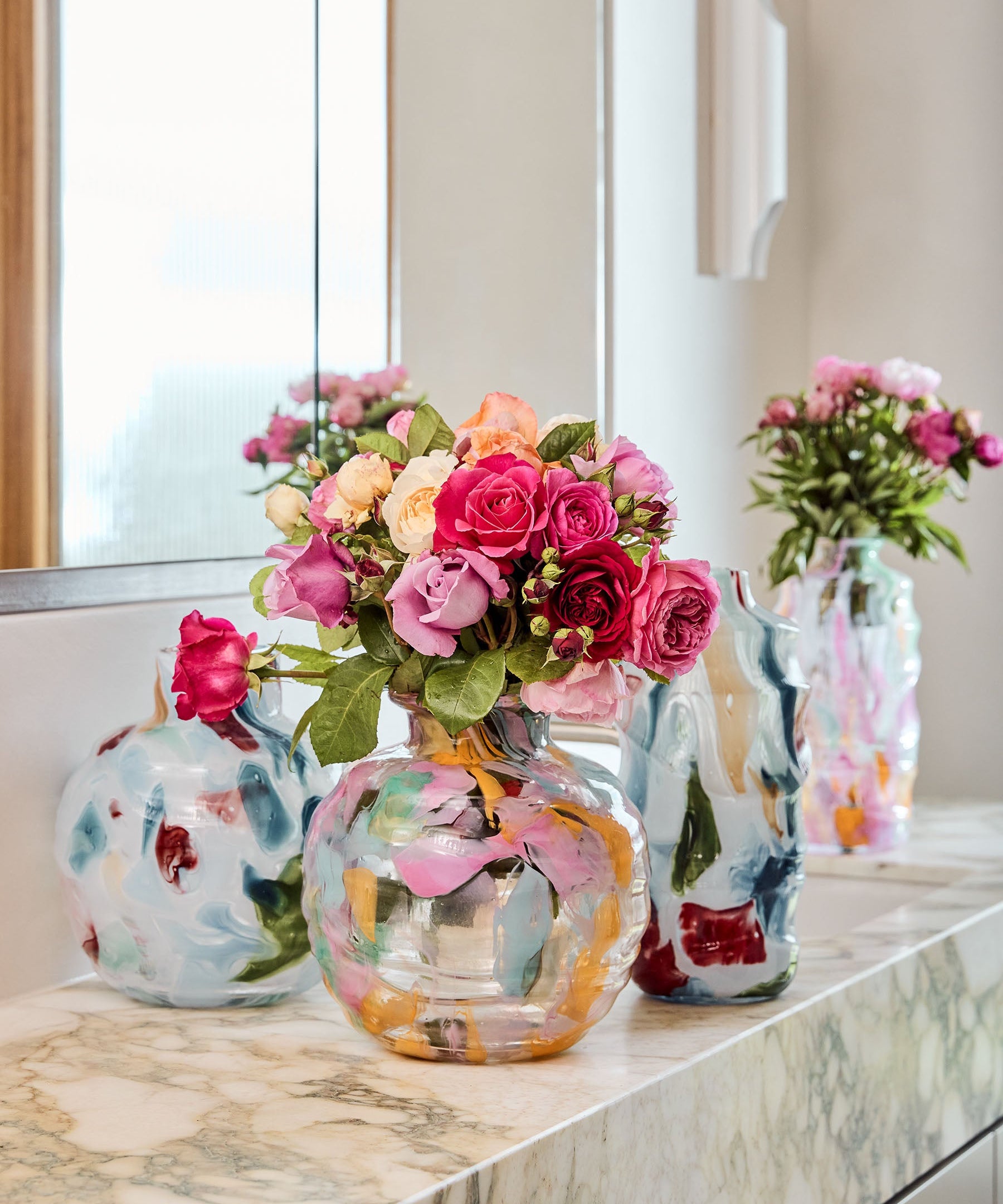 Kip & Co Swirl Sorbet round vase with colorful, abstract swirl design, made of ceramic, ideal for decorative floral arrangements.