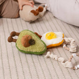 Living Textiles 2-pack mini market stroller toys featuring plush avocado and egg on toast for baby fun and sensory play.