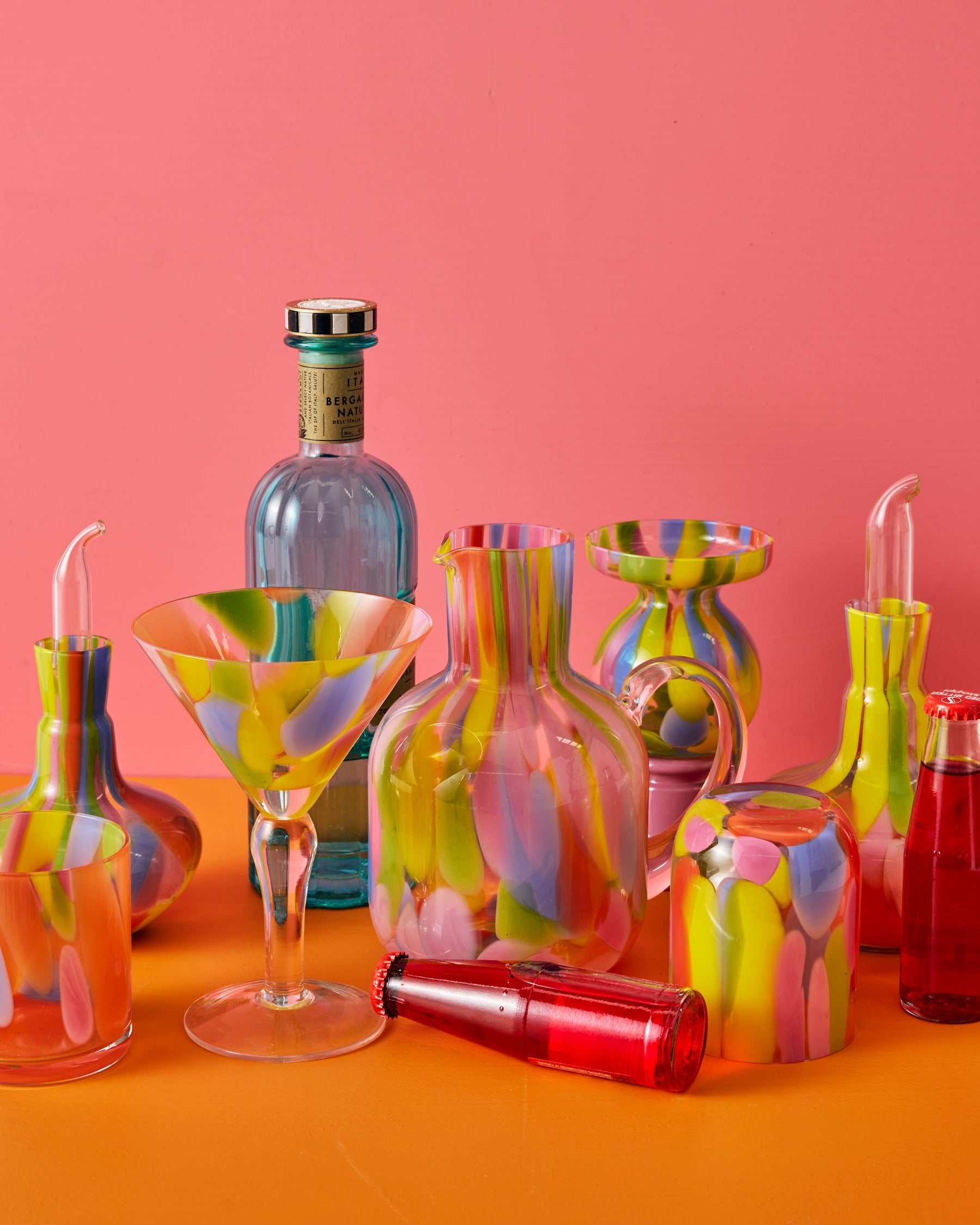 Kip & Co Festiva glass and carafe set with colorful floral pattern on clear glass, showcasing stylish drinkware.