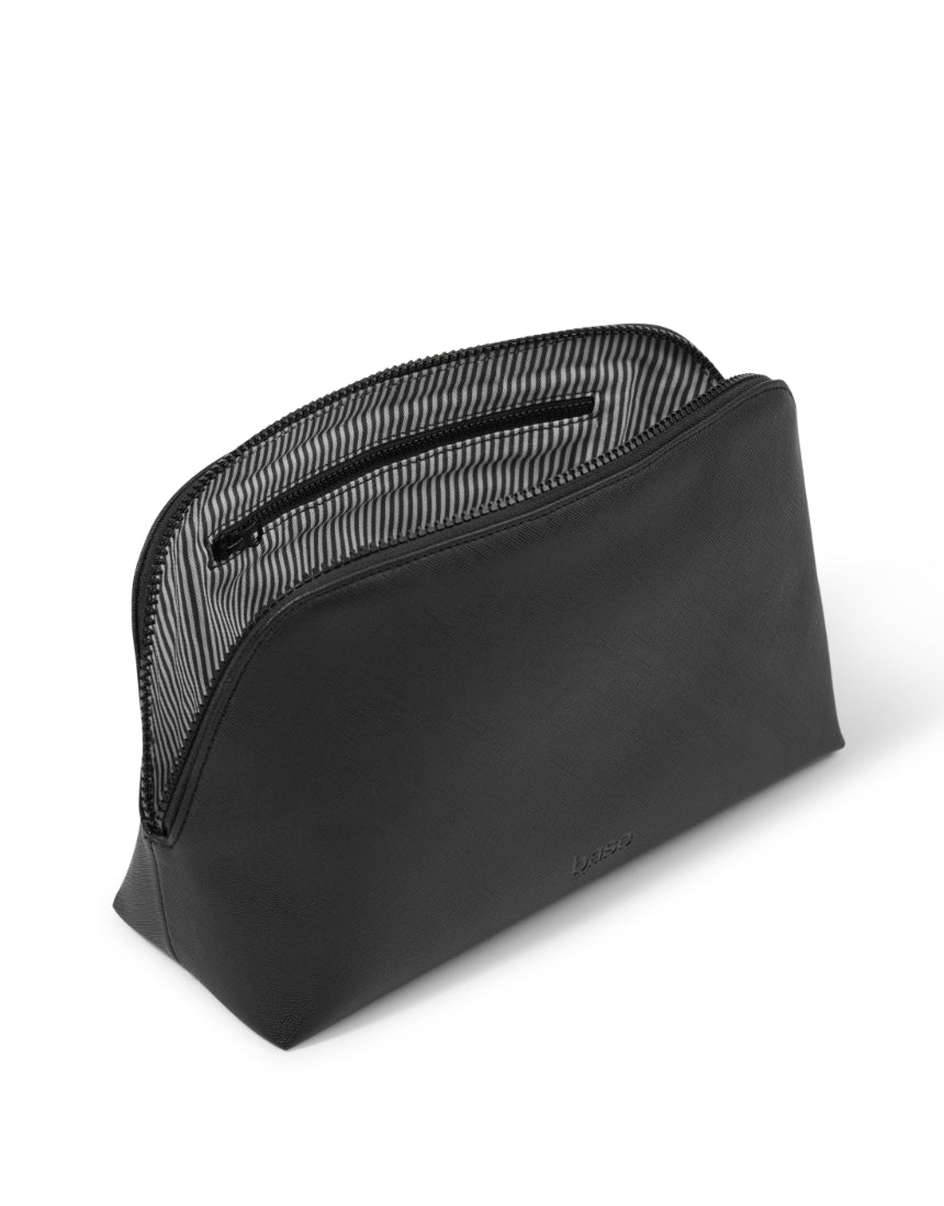 Large black Base cosmetic case with zipper closure and handle, shown open with compartments for makeup and beauty essentials.