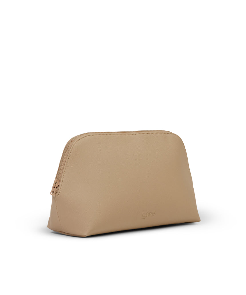 Large sand-colored cosmetic case by Base, featuring a sturdy design with multiple compartments for organized makeup storage.