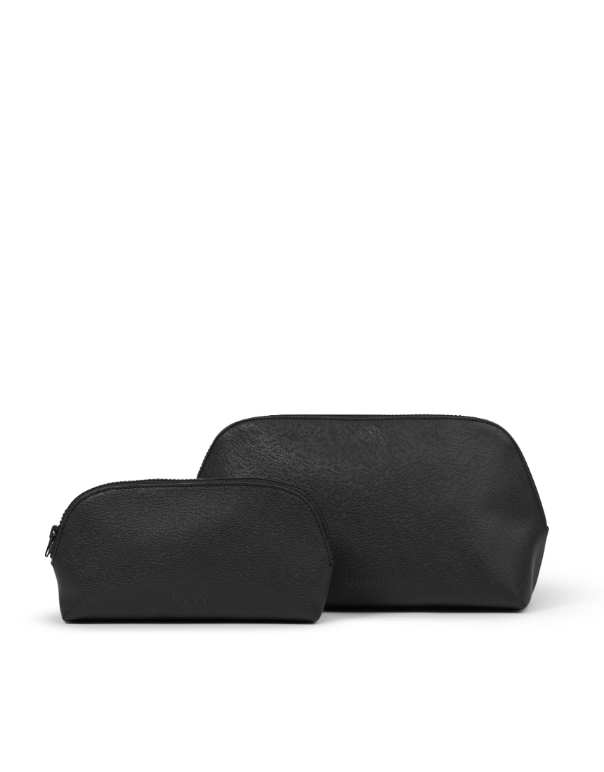 Large black cosmetic case by Base with a sleek, sturdy design and multiple compartments for organizing makeup and beauty essentials.