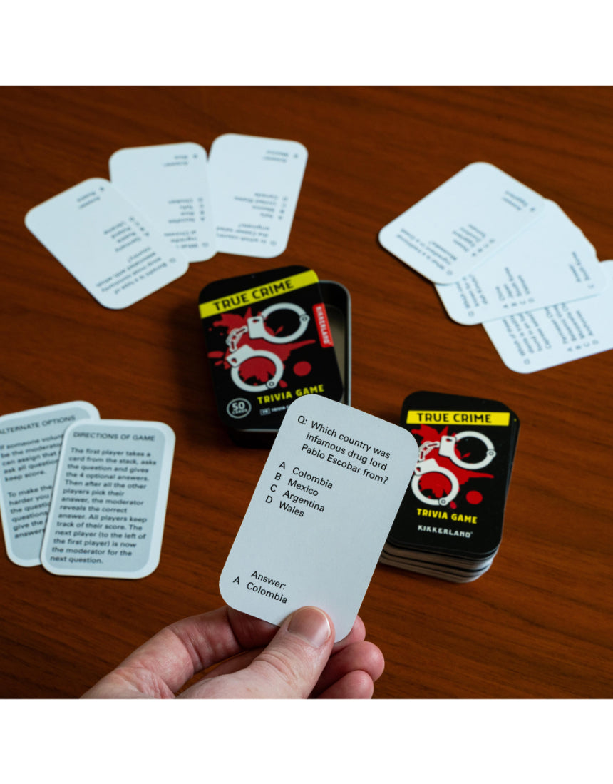 True Crime Trivia Tin by isAlbi, featuring a compact metal container with trivia cards and themed artwork related to true crime.
