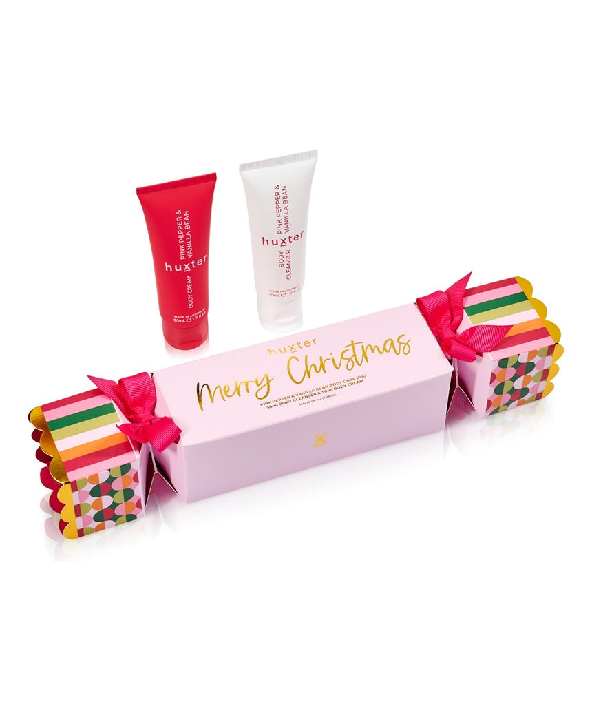 Huxter Christmas Body Care Bon Bon set with pink pepper and vanilla bean, featuring wrapped body care products with festive packaging