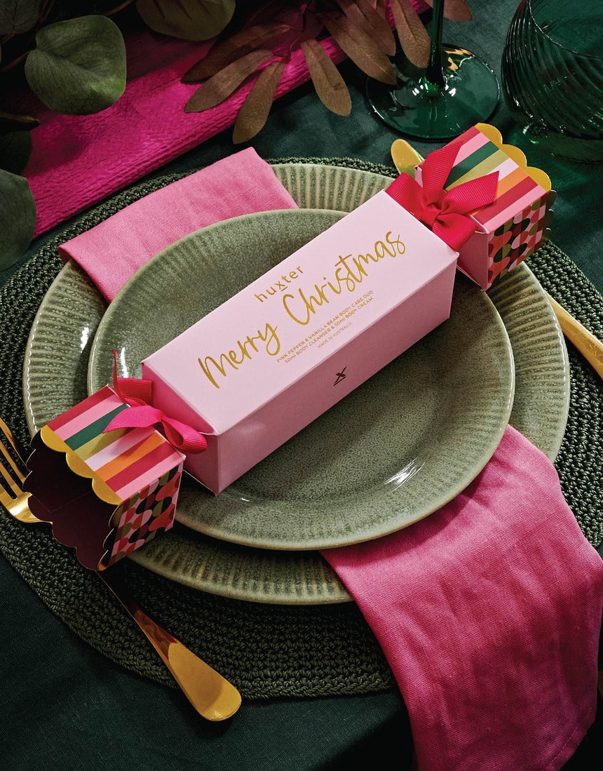 Huxter Christmas Body Care Bon Bon styled on a festive table
