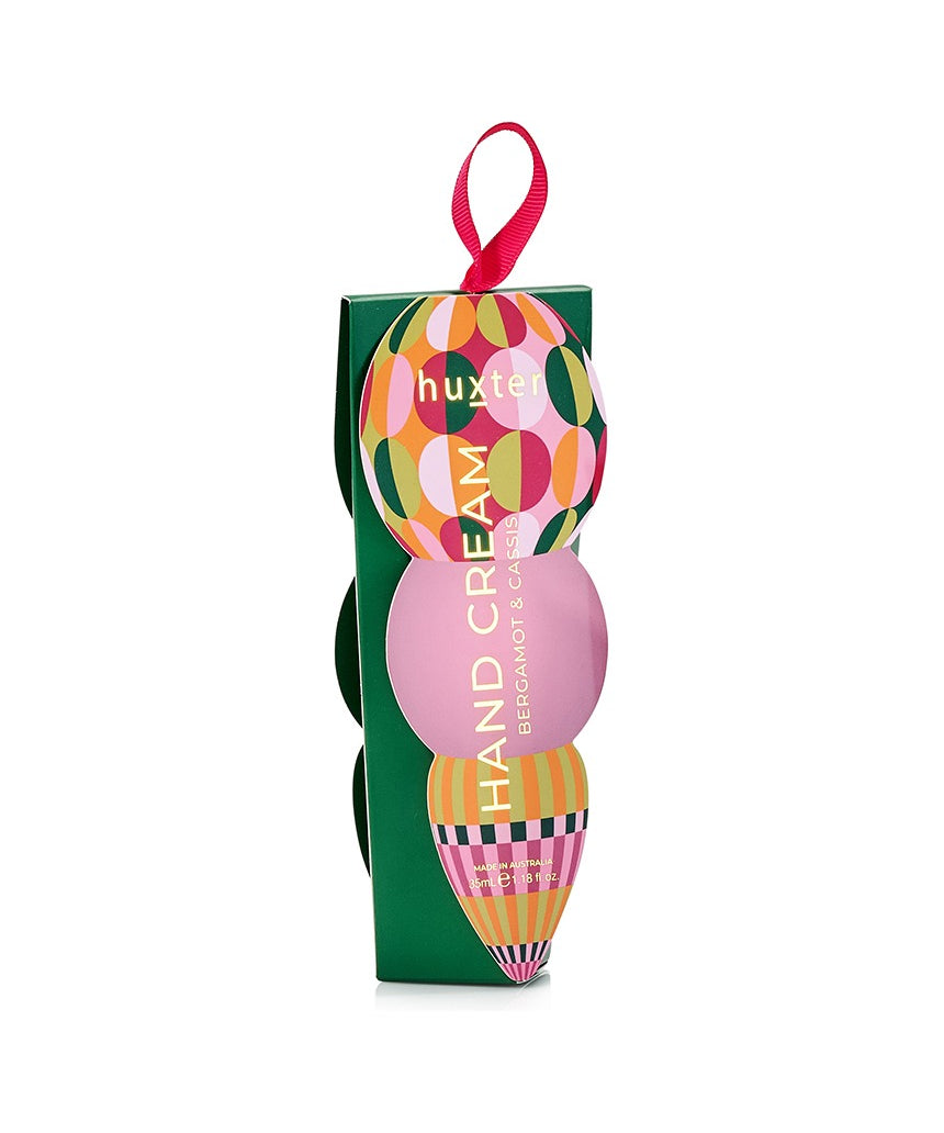 Huxter Adorned Christmas Hanging Hand Cream in green with festive design, featuring a decorative hanging ornament for holiday skincare.