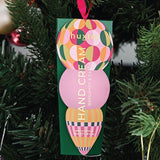 Huxter Green Hanging Hand Cream on a Christmas tree