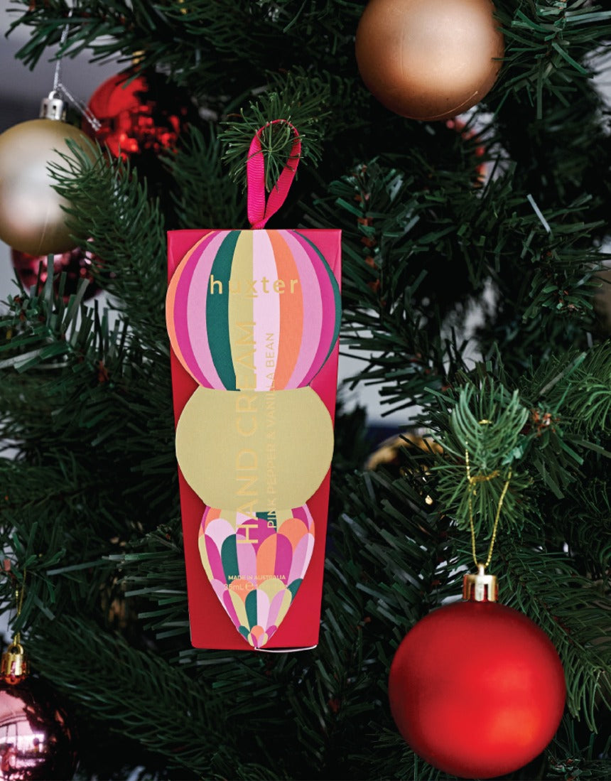 Huxter Mulberry Hanging Hand Cream on a Christmas tree