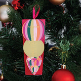 Huxter Mulberry Hanging Hand Cream on a Christmas tree
