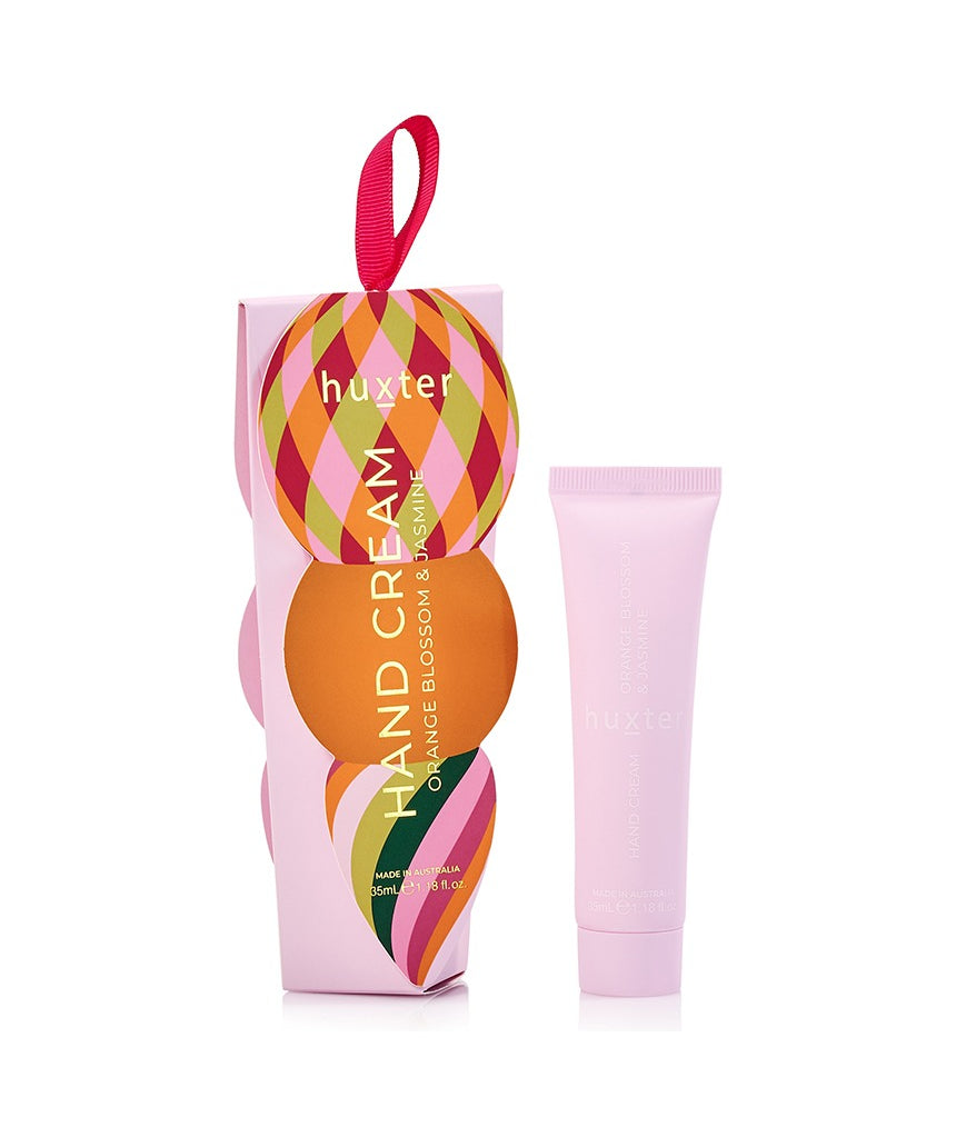 Huxter Adorned Christmas Hanging Hand Cream in soft pink with festive decorative packaging, perfect for holiday gift-giving.