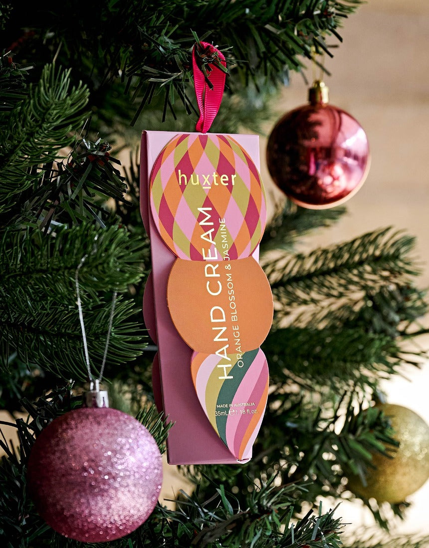 Huxter Soft Pink Hanging Hand Cream on a Christmas tree